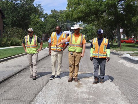 City officials inspecting Waukegan road construction and community improvement project.